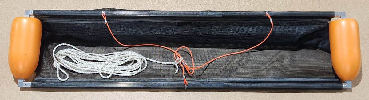 Assembled DeSkuzzer bar with both snap buttons seated