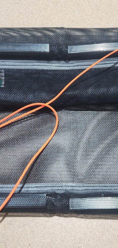 Inserting the smaller aluminum tubing into the larger tubing